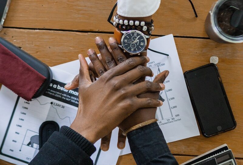 Person Wearing Black Long Sleeve Shirt and Black Analog Watch